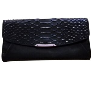 Coach Black Textured leather walet with metallic details.